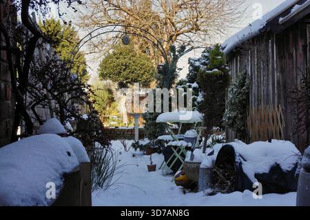 deep snow covered a garden after a cold wave brought  snowy weather to the UK in feb 2021 Stock Photo