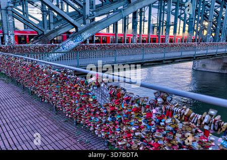 Love locks on the Hohenzollern Bridge in Cologne, Germany, overlooking the Rhine Stock Photo