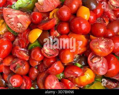 Fresh tomatoes red yellow green cutted slices I Stock Photo