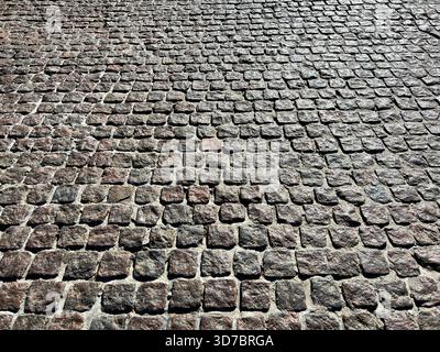 Pavement stone block paving tiles background Stock Photo