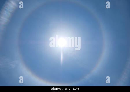 Sun halo in the blue sky Stock Photo