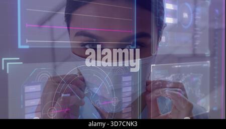 Adjusting adult female scientist holding protective face mask and using holographic HUD in lab Stock Photo