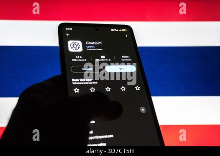 ChatGPT app on smartphone in front of the flag of Thailand. Baku, Azerbaijan. 11.25.2025. Stock Photo
