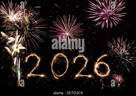 2026 made with sparklers on black background Stock Photo