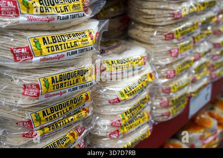 Close view of bags of flour tortillas from the Albuquerque Tortilla brand stacked on the shelf inside a Sam's Club supermarket Stock Photo