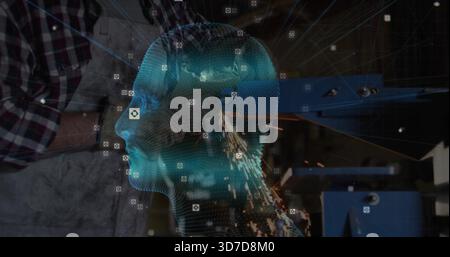 Displaying cyan hologram head with sensor icons over metal shop, worker wearing plaid apron Stock Photo