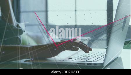 Typing adult female wearing light t-shirt on laptop at desk, backlit by window with magenta overlay Stock Photo