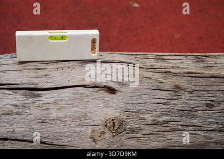 small spirit level on wood Stock Photo