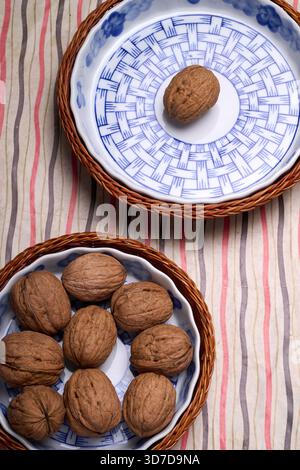 nuts in an earthenware basket from above Stock Photo