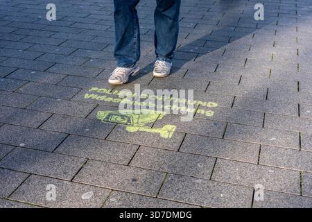 Notice sprayed on the ground stating that the police have set up comprehensive video surveillance in Dortmund city centre, in front of the main railwa Stock Photo