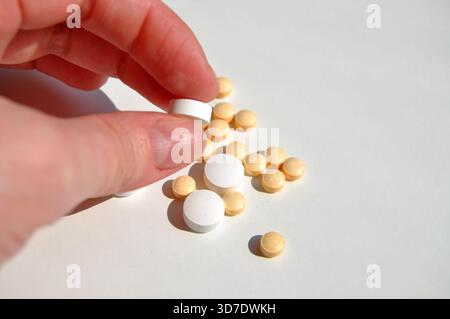 A hand holding pills. Medicine and drungs. Stock Photo