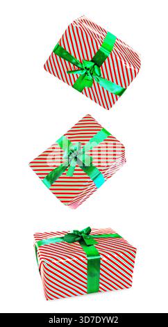 A group of small, colorful gift boxes wrapped in festive paper with ribbons, isolated on a transparent or white background. High quality photo Stock Photo