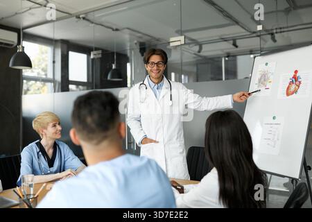 Young multiethnic team of doctors having team-building Stock Photo