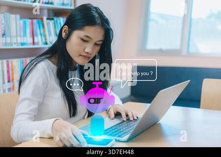 Asian woman interacting with AI chatbot hologram using smartphone and laptop in a modern library. Concept of virtual assistant, artificial intelligenc Stock Photo