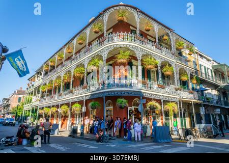 Music band, French Quarter Festival flag and historical LaBranche building with balconies and intricate ironwork columns in New Orleans, Louisiana Stock Photo