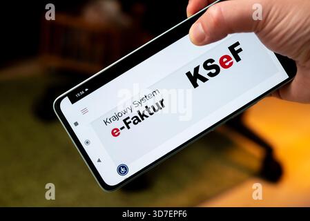 Lublin, Poland 24 November 2025 Mandatory B2B electronic invoicing system ('KSeF'), or ('Krajowy System e-Faktur') webpage on a mobile phone Stock Photo