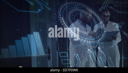 Analyzing two scientists studying hologram in lab with tablet, lab coats and goggles, copy space Stock Photo