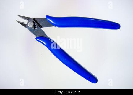 Blue side cutting wire pliers isolated on white background. Stock Photo