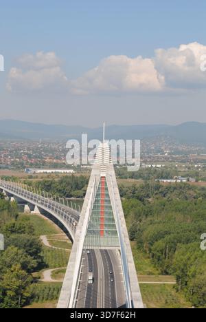 Panoramic view from the top of the eastern pylon of Megyeri bridge over the river and the double roadway on a sunny summer day Stock Photo