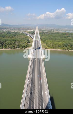Panoramic view from the top of the eastern pylon of Megyeri bridge over the river and the double roadway on a sunny summer day Stock Photo