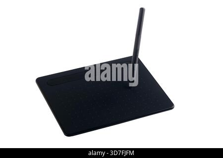Black graphic drawing tablet with stylus pen isolated on transparent background. Perfect for digital art, design, and creative workspaces. Stock Photo