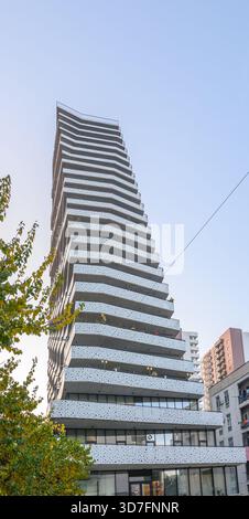 A high-rise residential building in Saburtalo district, Tbilisi featuring distinctive protruding balconies. This architectural style is characteristic Stock Photo