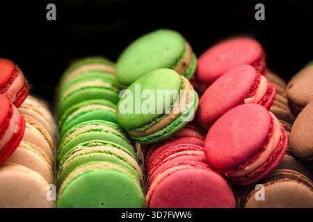 Freshly baked colourful Macarons in rows Stock Photo