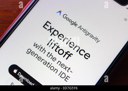 Close-up of a smartphone displaying Google Antigravity website, promoting a next-generation integrated development environment for developers. Stock Photo