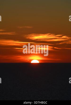 Sunset with orange sky over the Tyrrhenian Sea. Stock Photo