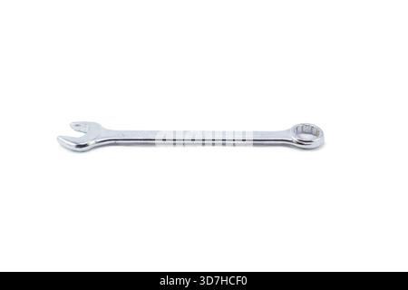 A small chrome-plated combination wrench with an open end and a closed end, isolated horizontally on white. Stock Photo