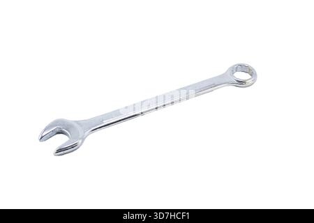 A small chrome-plated combination wrench with an open end and a closed end, isolated horizontally on white. Stock Photo