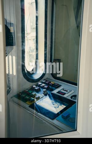 Industrial control panel enclosed in glass, showcasing switches and details. Toronto, ON Stock Photo