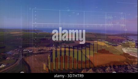 Showing translucent 3D data overlay centered over coastal fields and cliffs, with bar charts Stock Photo