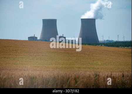 View on cooling towers of NPP, nuclear power plant thermal power station in which heat source is nuclear reactor, France, Europe, cheap energy source, Stock Photo