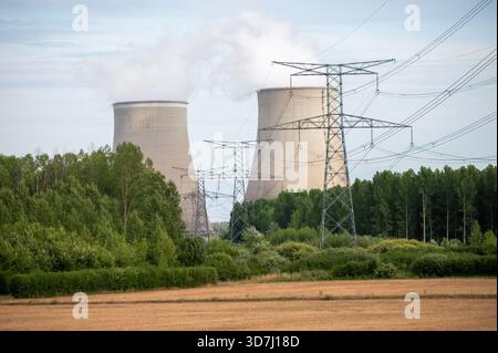 View on cooling towers of NPP, nuclear power plant thermal power station in which heat source is nuclear reactor, France, Europe, cheap energy source, Stock Photo
