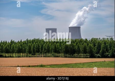 View on cooling towers of NPP, nuclear power plant thermal power station in which heat source is nuclear reactor, France, Europe, cheap energy source, Stock Photo