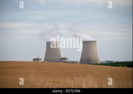 View on cooling towers of NPP, nuclear power plant thermal power station in which heat source is nuclear reactor, France, Europe, cheap energy source, Stock Photo