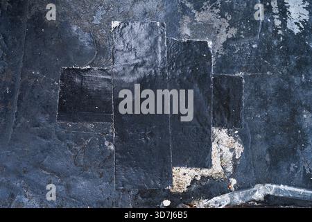 Black grunge wall texture with black cloth tape Stock Photo