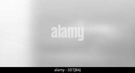 Textured monochromatic background resembling frosted or etched glass with subtle gray gradient. It features bright white light source on the left and Stock Photo