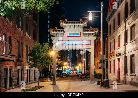 Montreal, Canada - August 15, 2025: Entrance arch to Chinatown at night in downtown Montreal Stock Photo
