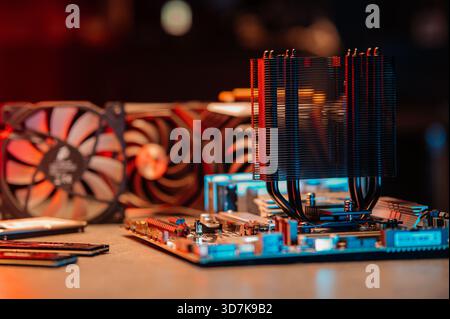 Black CPU tower cooler with a large fan and multiple heat pipes, designed for efficient computer cooling, isolated on a white background. Stock Photo