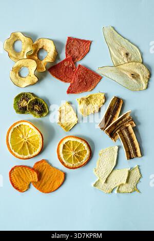 Diverse dried fruit slices arranged on vivid backdrop for inspiration Stock Photo