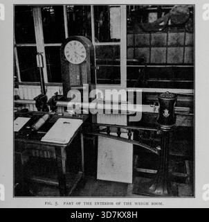PART OF THE INTERIOR OF THE WEIGH ROOM. The weigh room is divided from the electrical-instrument room by a partition to the left of the table. The spots of light from the reflecting galvonometer are thrown on a translucent scale on a panel in this partition, and thus are seen from the table in the weigh room. The nearest steelyard connects with the platform carrying the near tank in Fig. 3. The one just seen on the left connects with a second tank. The large sliding weight keeps count of each 1,000 lb. water of condensed, the smaller one registering smaller increments. The wires leading from t Stock Photo
