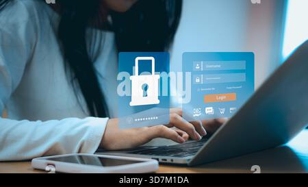 Woman using laptop with cybersecurity login interface, secure password protection, and online data security concept for technology, business, and digi Stock Photo