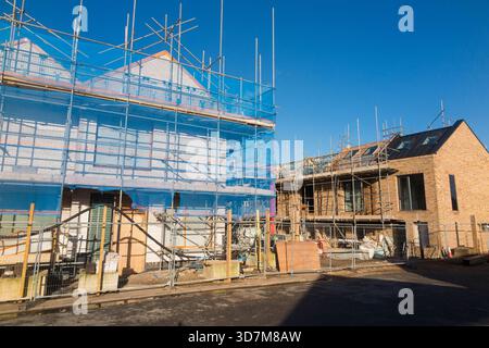 Construction site & partly built townhouses / housing block / new build / building new homes  / apartments / flat / flats on brown field / brownfield former bakery industrial site. Twickenham. UK. (146) Stock Photo