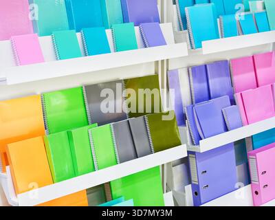 Colorful notebooks on a shelf in a store Stock Photo