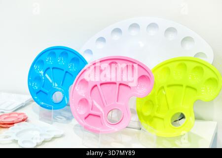 Plastic palettes for painting on a shop window Stock Photo