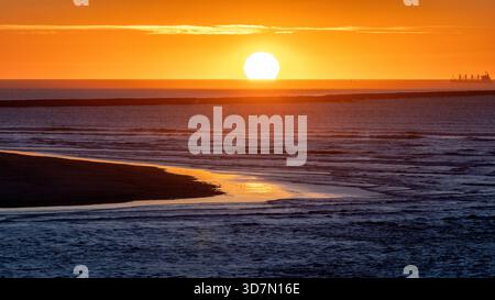 Vibrant sunset in the Pacific Ocean beyond the South Jetty in Astoria, Oregon, USA Stock Photo