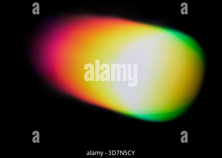 Abstract colorful light leak with soft gradient glow on a dark background. Vibrant retro-style blur effect ideal for vintage photo overlays. Stock Photo