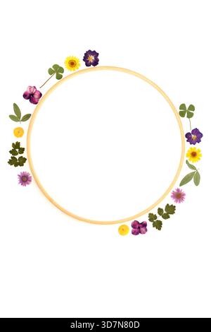 Dried pressed flower leaf abstract wreath on white background. Wooden frame decorative art design for greeting card, logo, invitation. Stock Photo